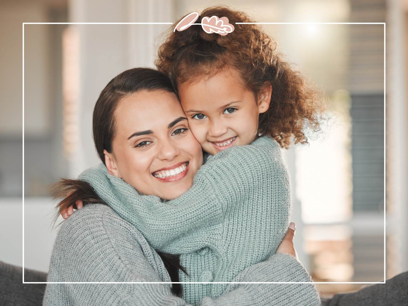 Mother and daughter sharing a warm embrace in cosy sweaters, celebrating Mother’s Day love and joy.