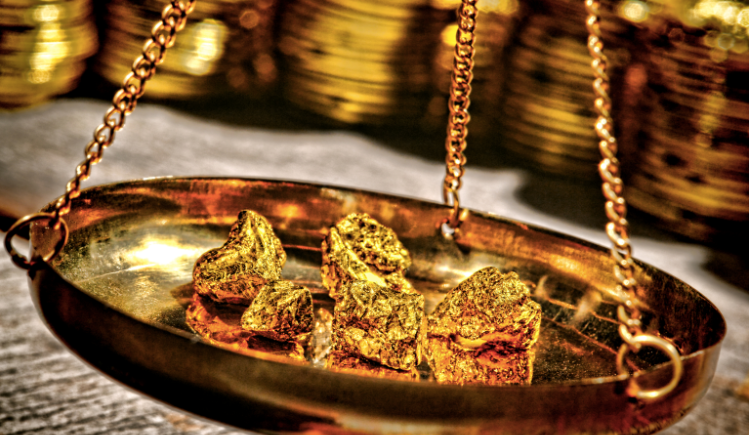 Gold bullion weighed on scale