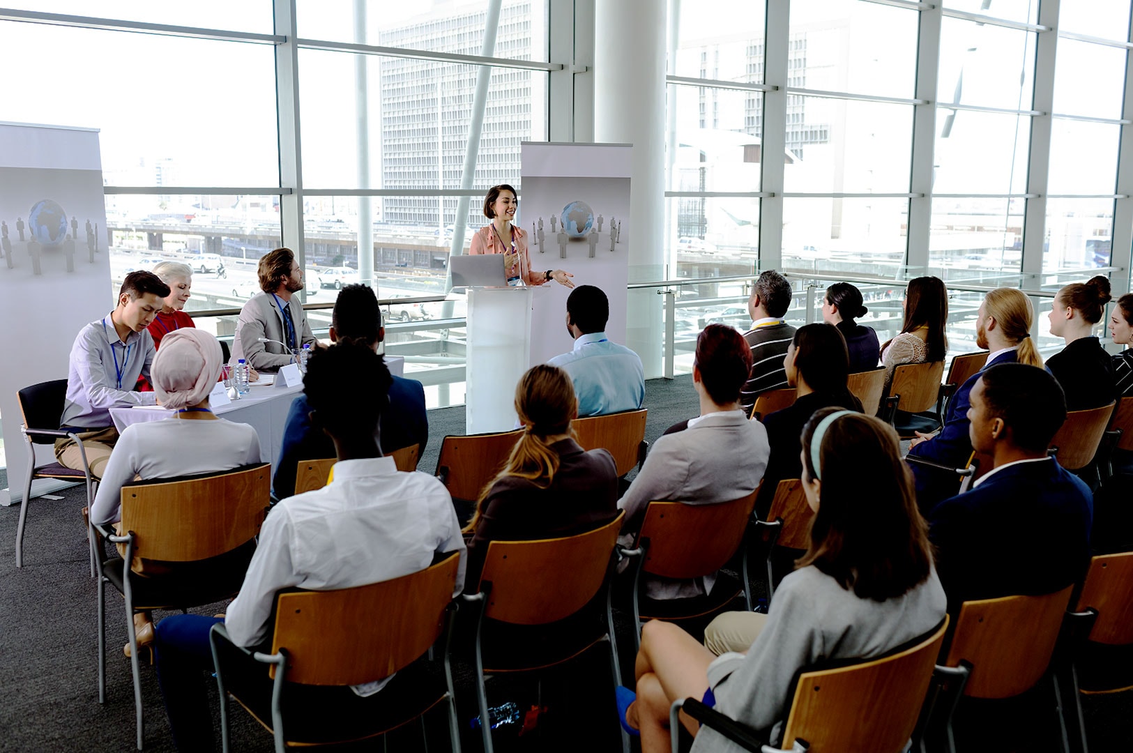 Corporate seminar with professionals attending a business presentation.