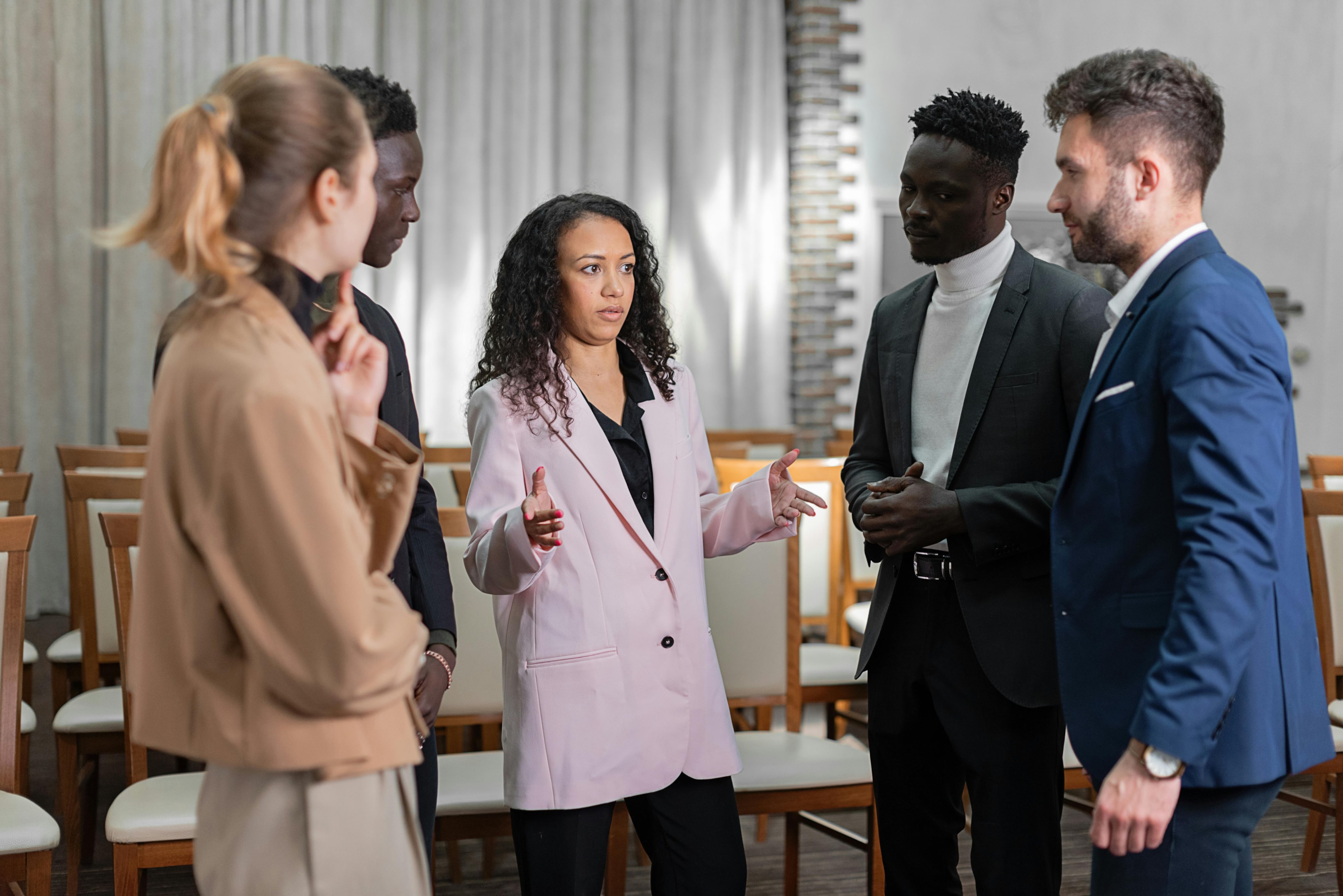 Real estate professionals network at business event.