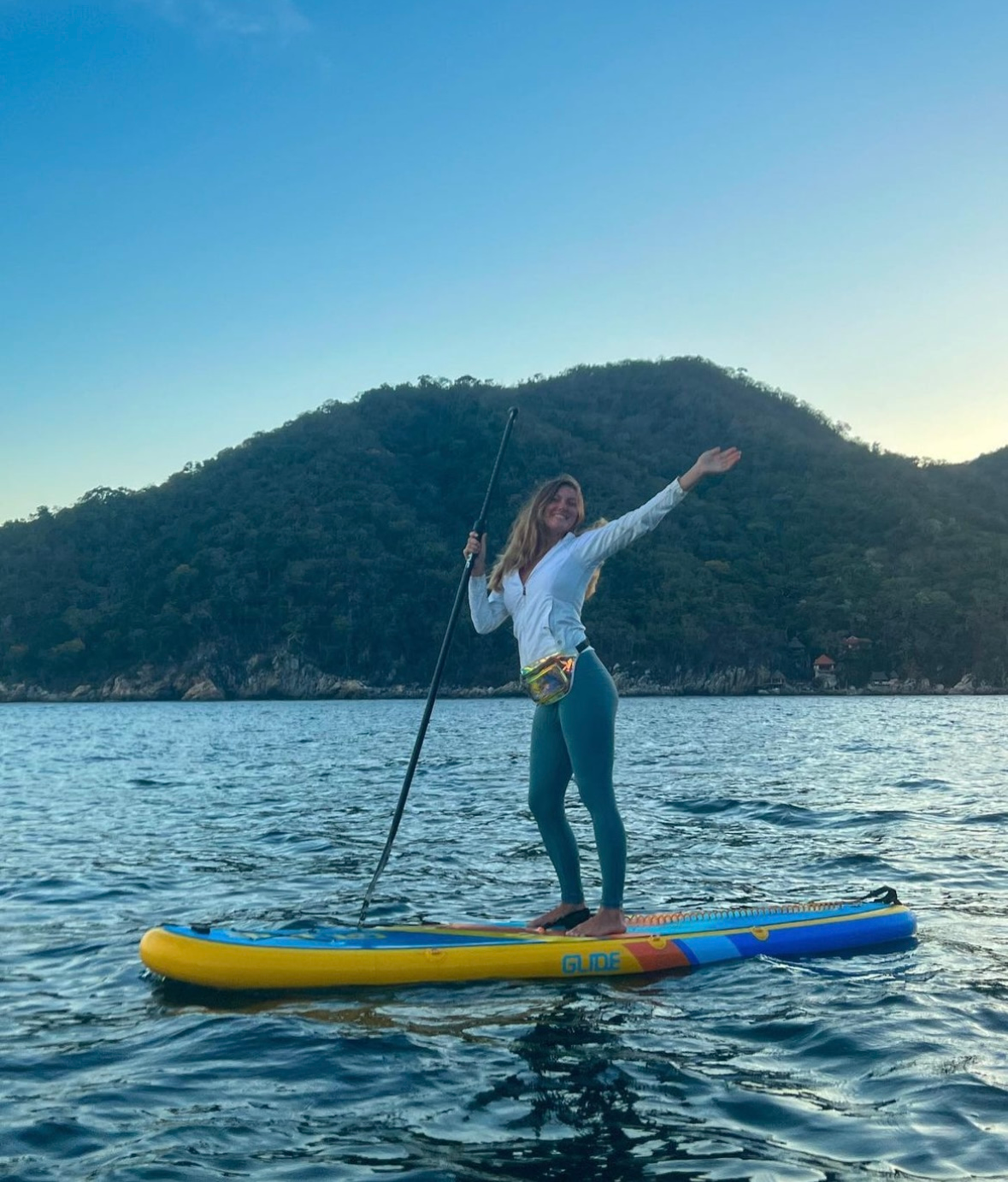 woman on an inflatable stand up paddle board