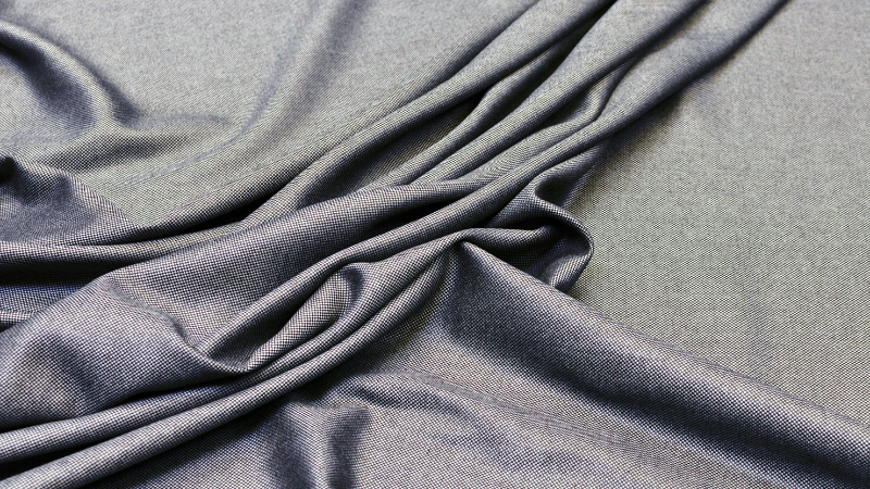 A close-up view of a dark gray viscose fabric