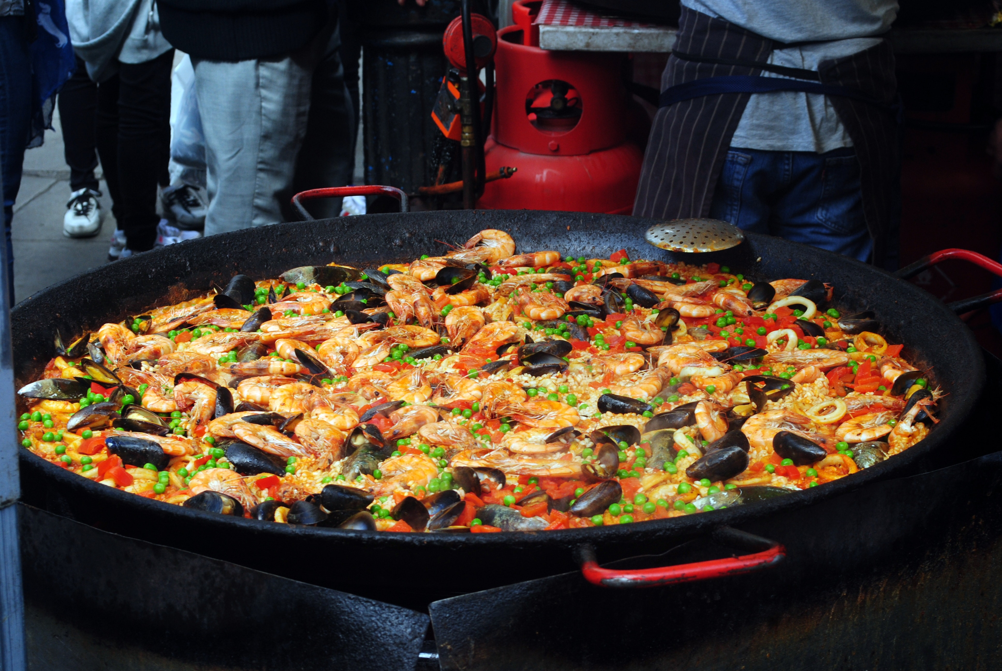 Image source: https://www.pexels.com/photo/delicious-paella-with-mollusks-in-big-frying-pan-4305836/    Caption: Delicious paella with mollusks in big frying pan