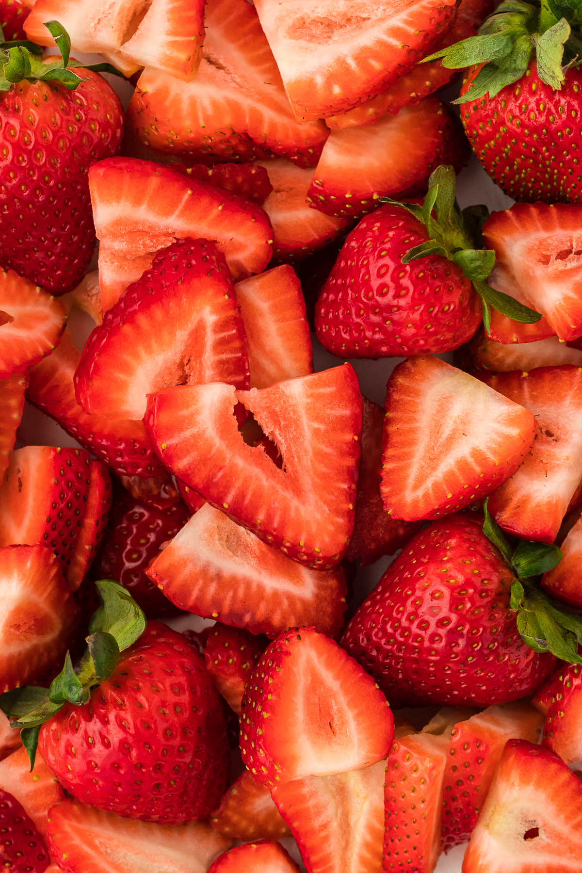 sliced strawberries and whole strawberries