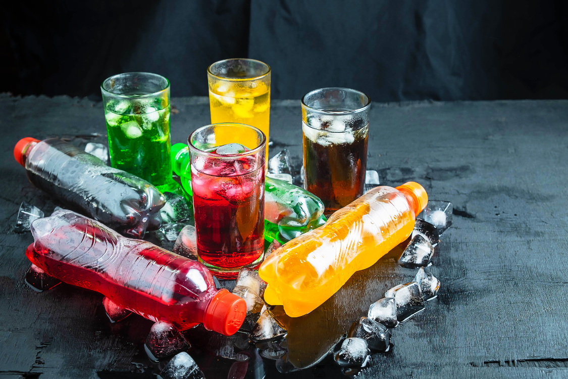 Chilled functional beverages served in bottles and glasses with ice for refreshment