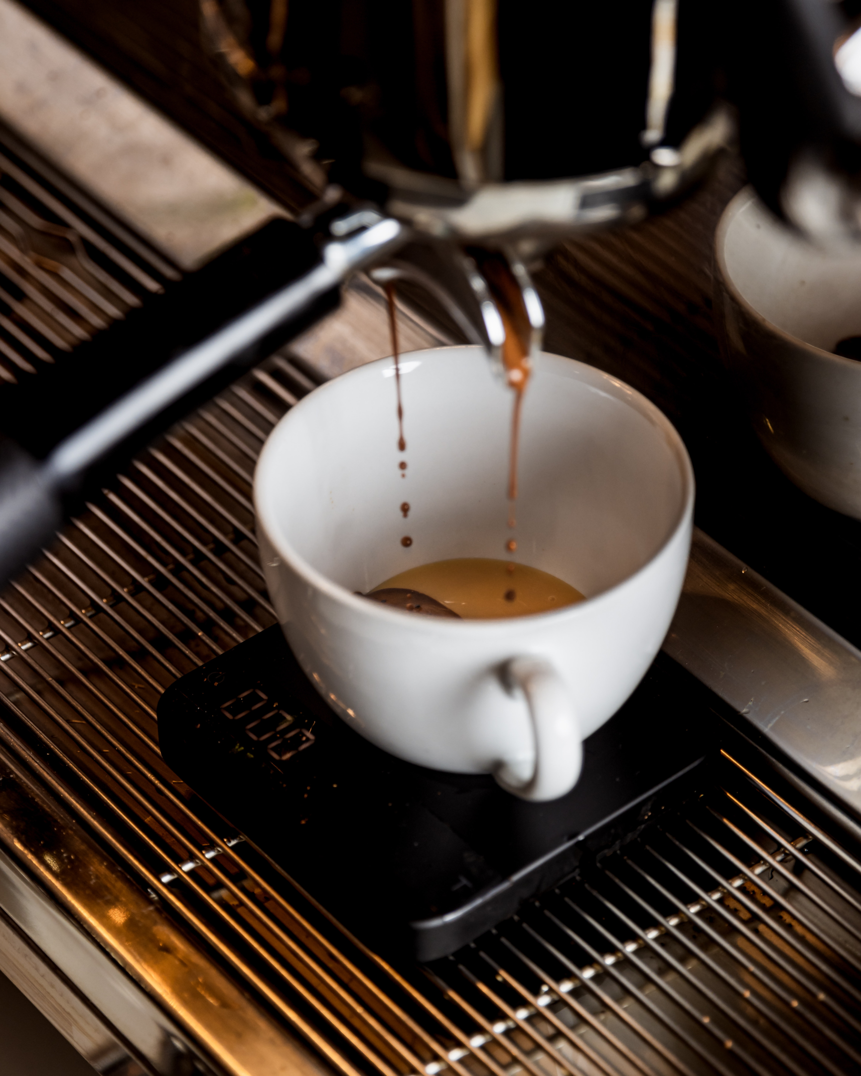 espresso being extracted from machine