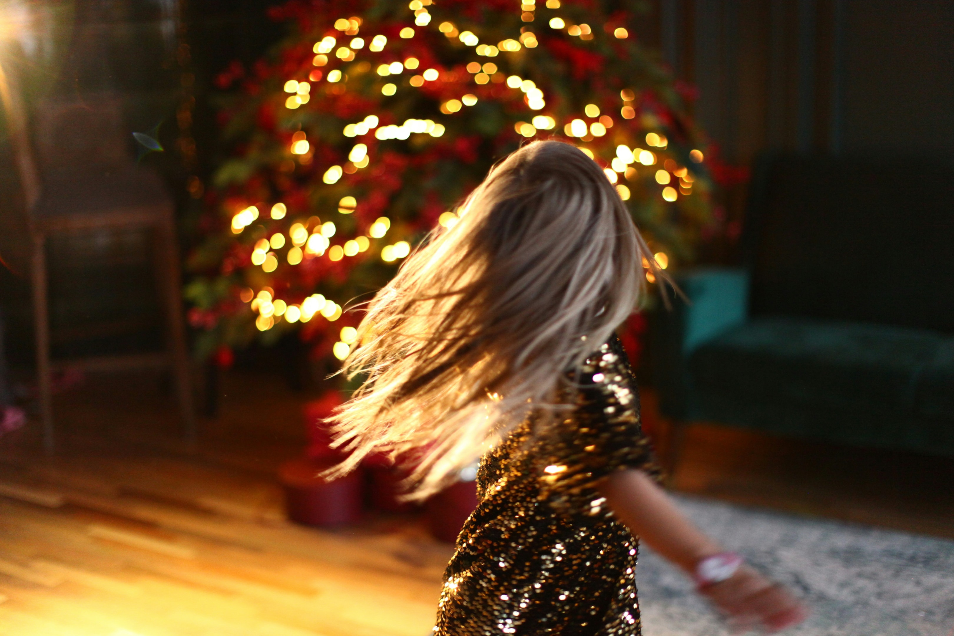 Photo by Olga Pukhalskaya, girl spinning in a sparkly dress