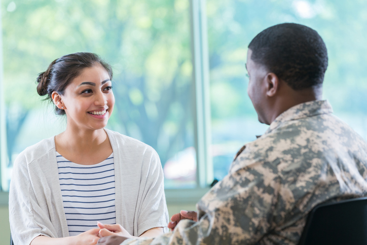 Army vet talking with a job placement specialist.