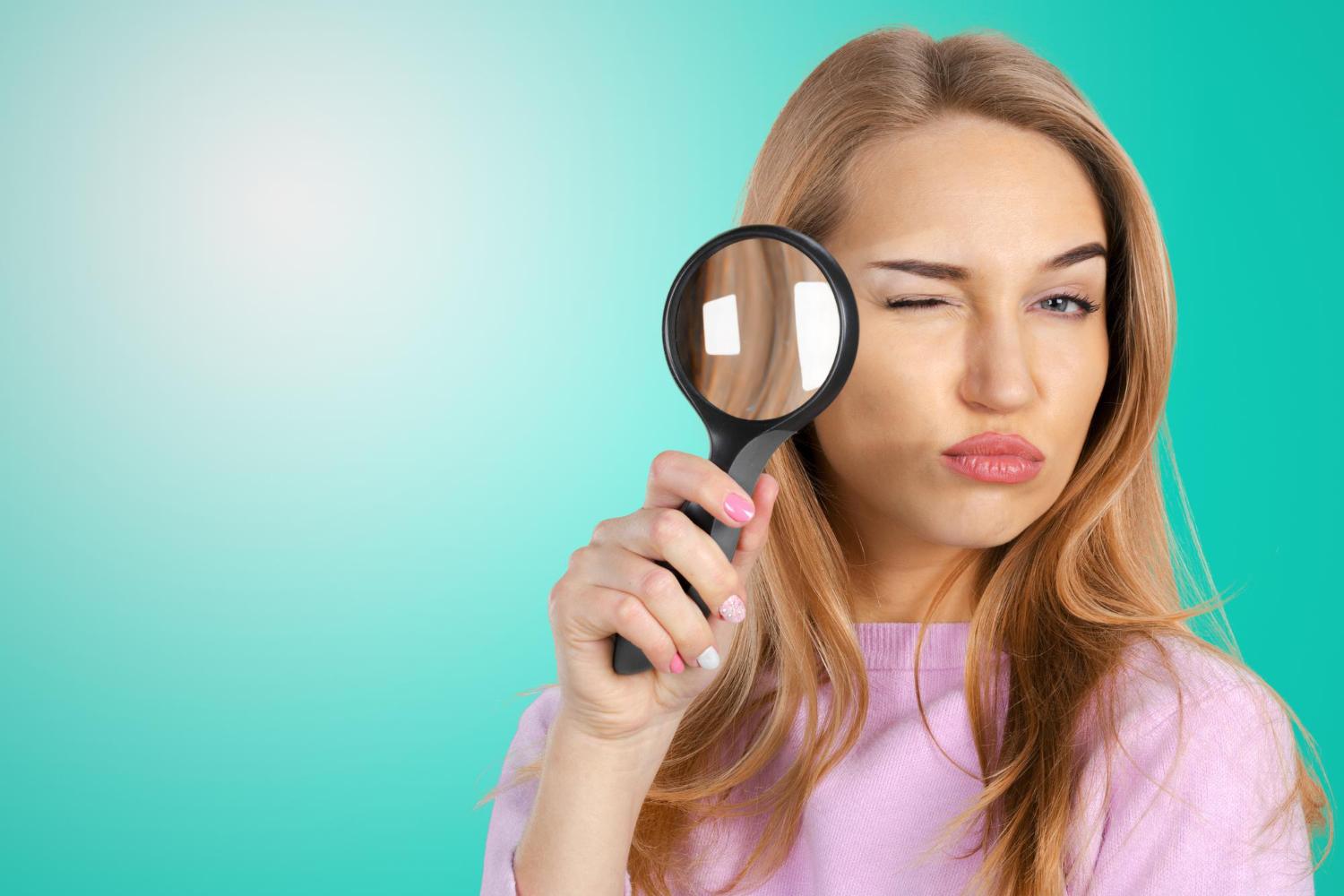 woman looking at competitor ad library for display advertising intelligence