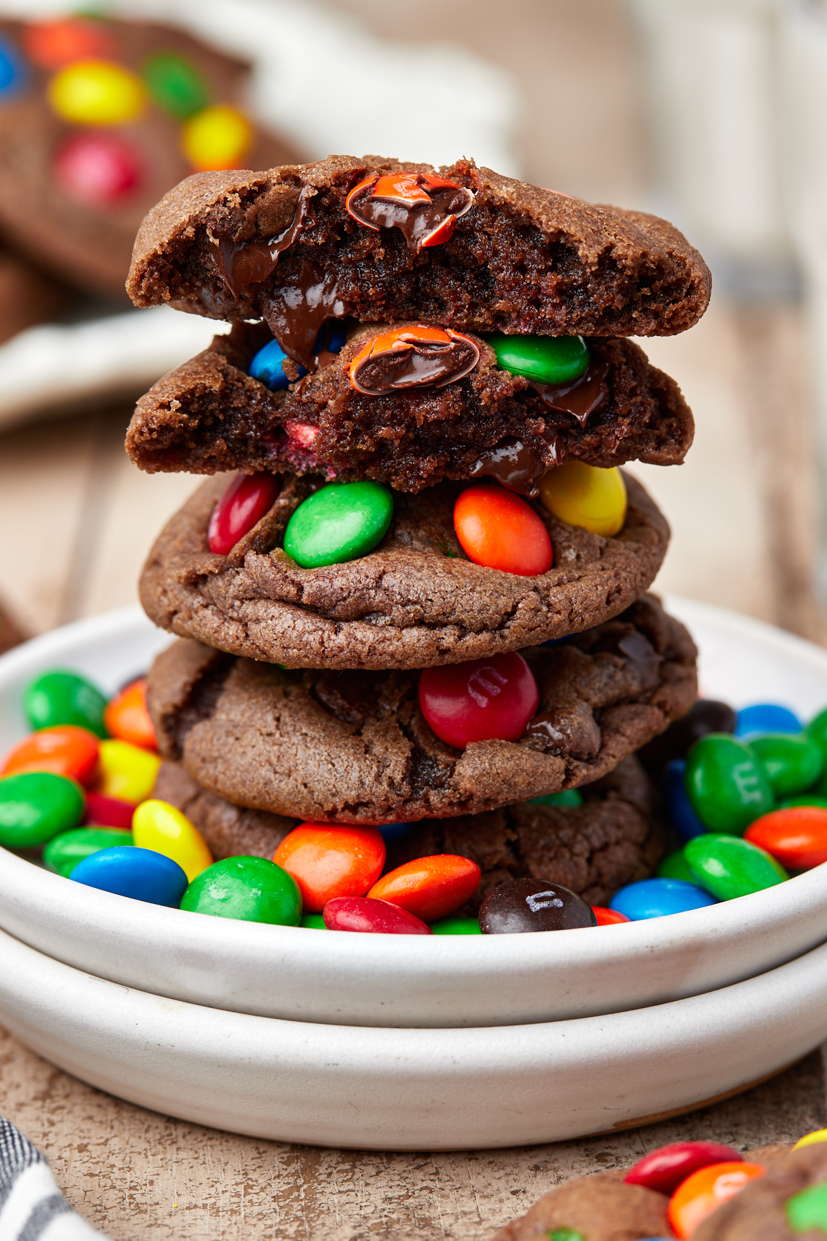 five M&M chocolate cookies stacked on top of each other