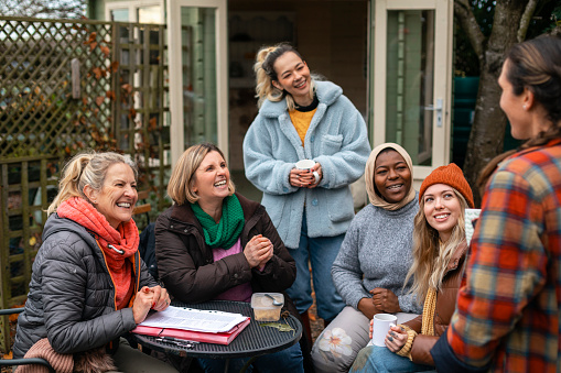 Women communicating effectively with a group - an important skill for women in philanthropy.