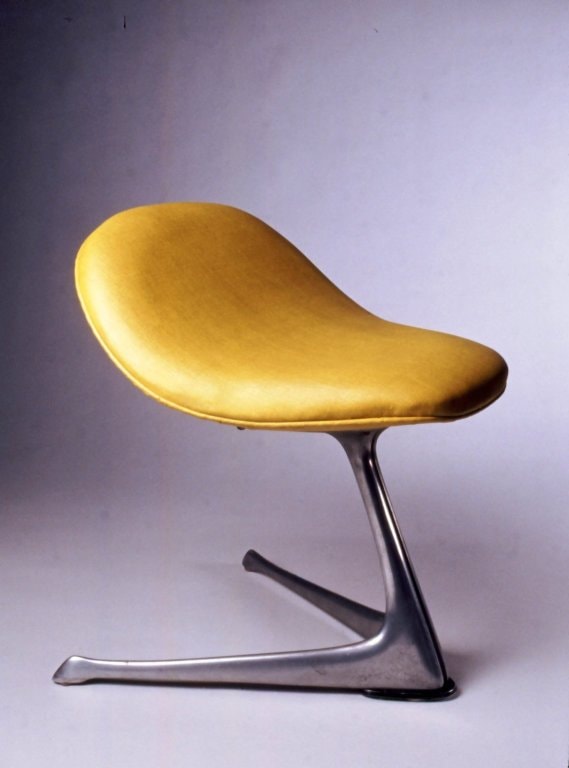 A Vladimir Kagan stool from the '60s now in the Brooklyn Museum that is an icon of mid century design and often paired with club chairs