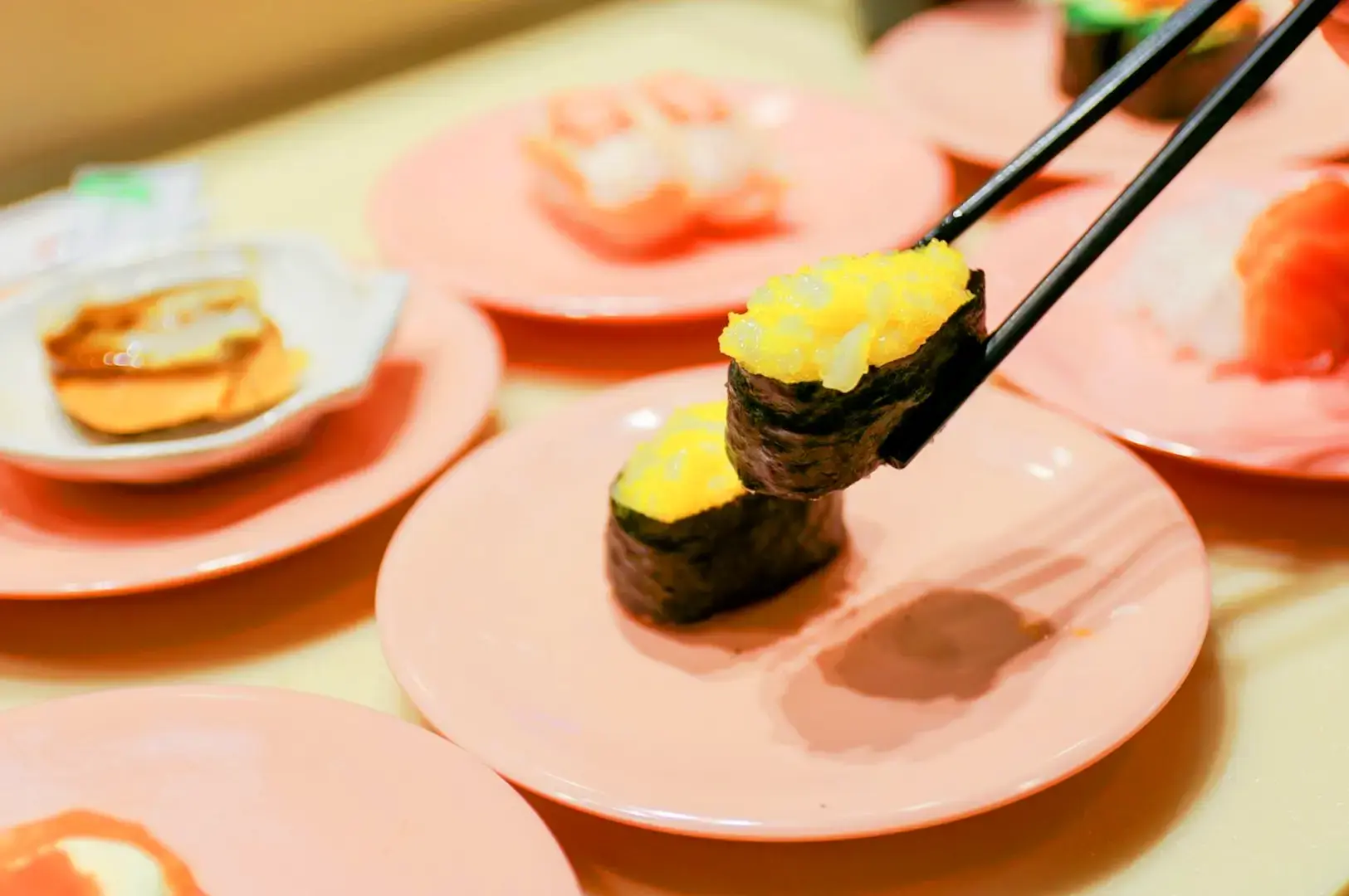 Sushi Express Singapore sushi spread featuring assorted sushi, rolls, tamago, side dishes and Japanese favourites
