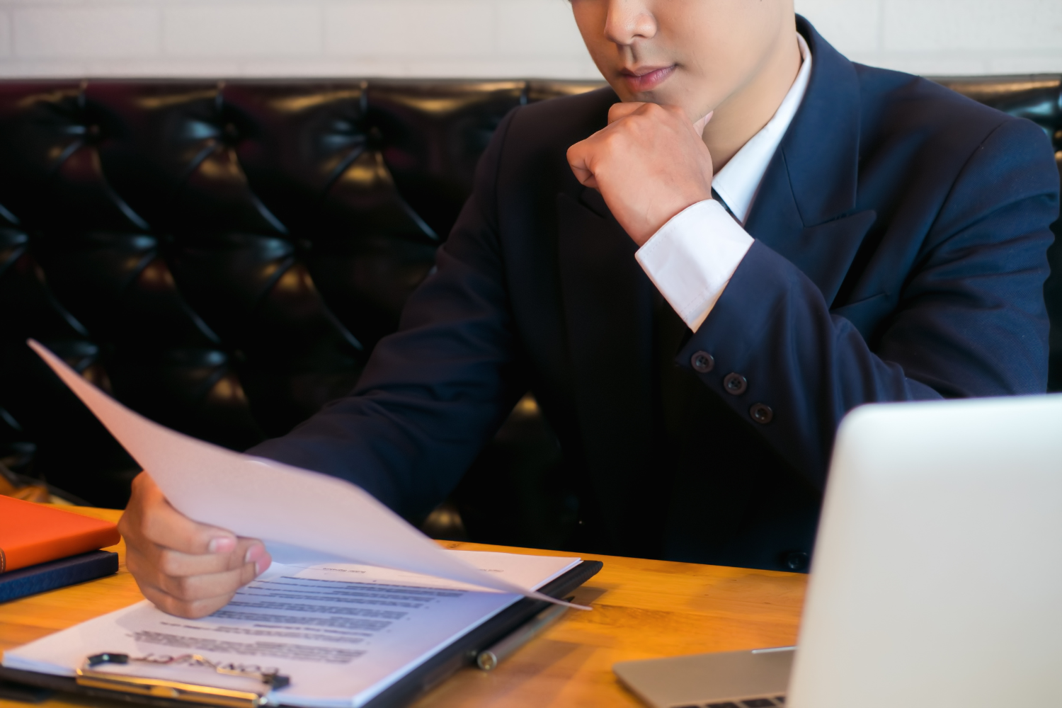 Startup founder reviewing resumes.