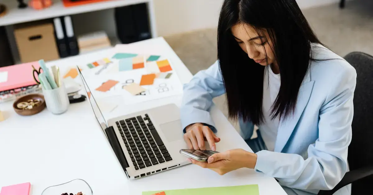 Woman reviewing Form 8822-B after updating her business mailing address for IRS records.