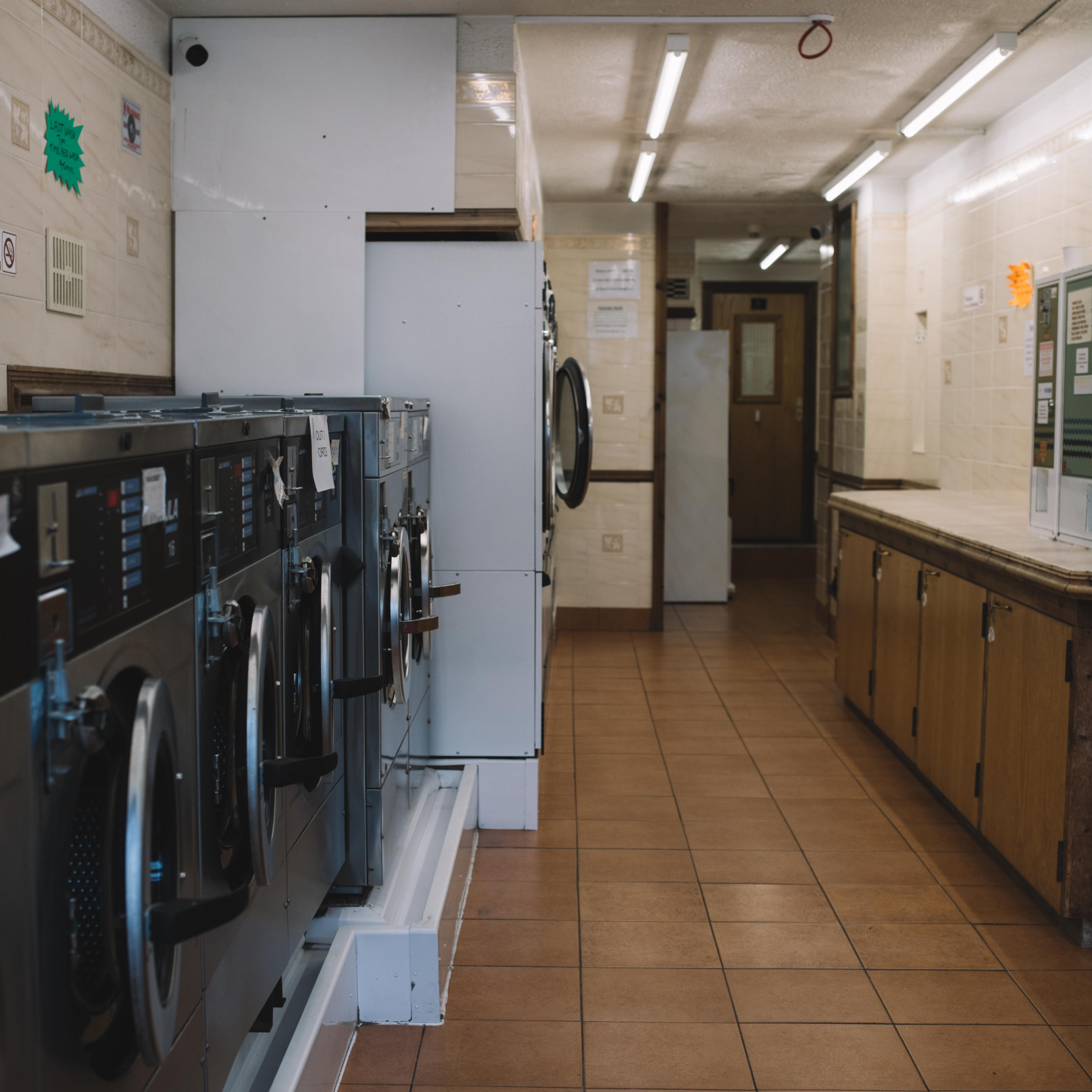 An on-site laundry room provided for the building's apartment community 