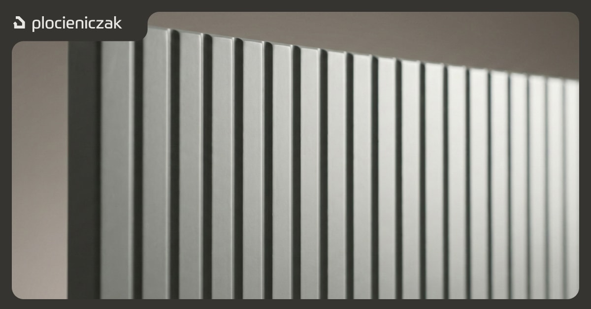 Zbliżenie na ryflowany front meblowy z płyty MDF z widocznymi precyzyjnymi żłobieniami i matowym wykończeniem w szarym kolorze