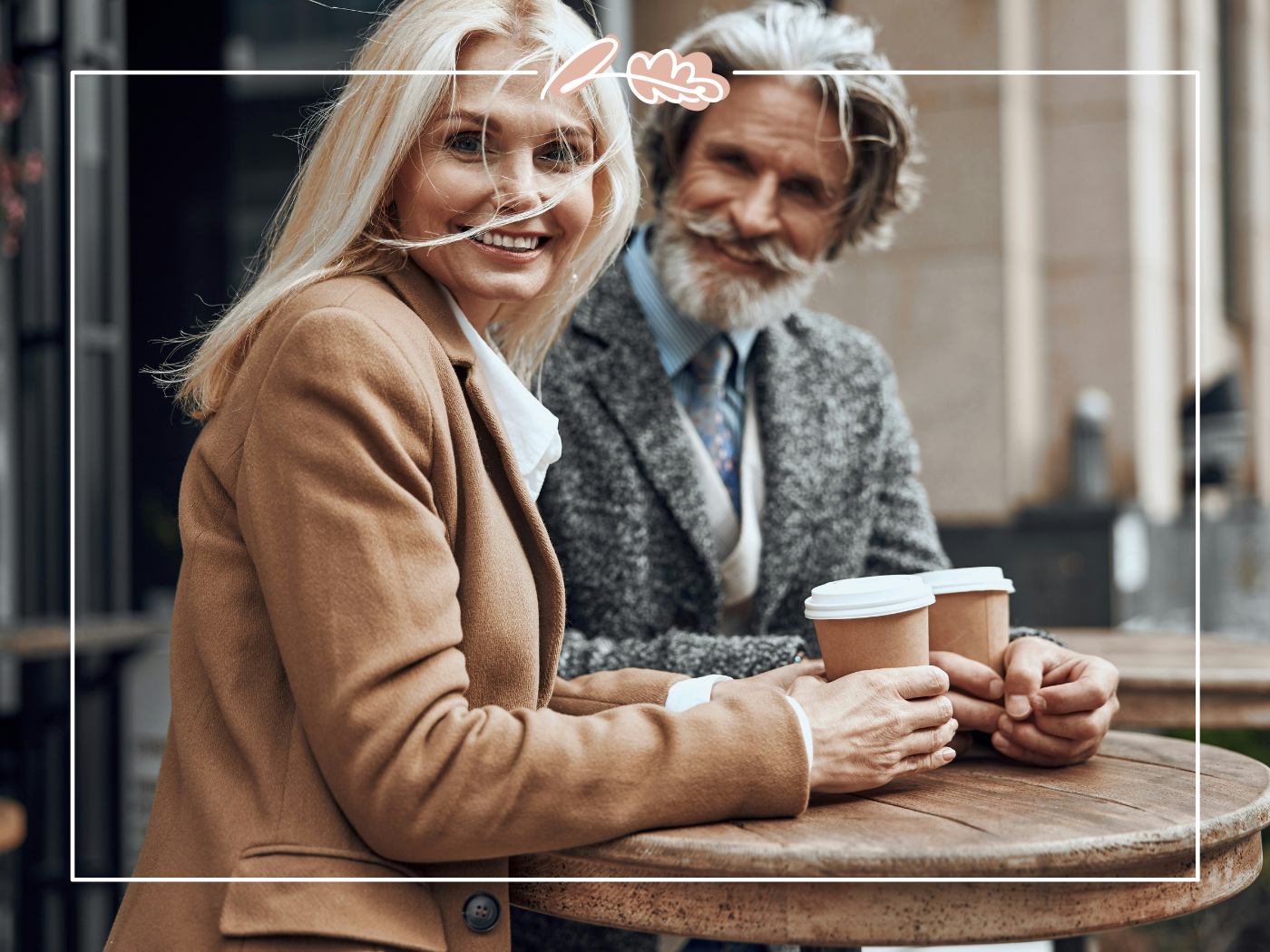 Smiling older couple sitting outside with paper cups of coffee. Fabulous Flowers and Gifts