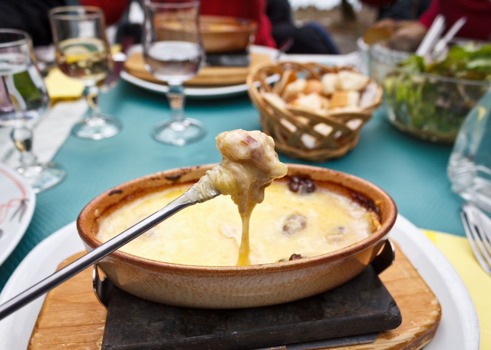 A close up shot of scrumptious cheese fondue at a restaurant near Blausee.
