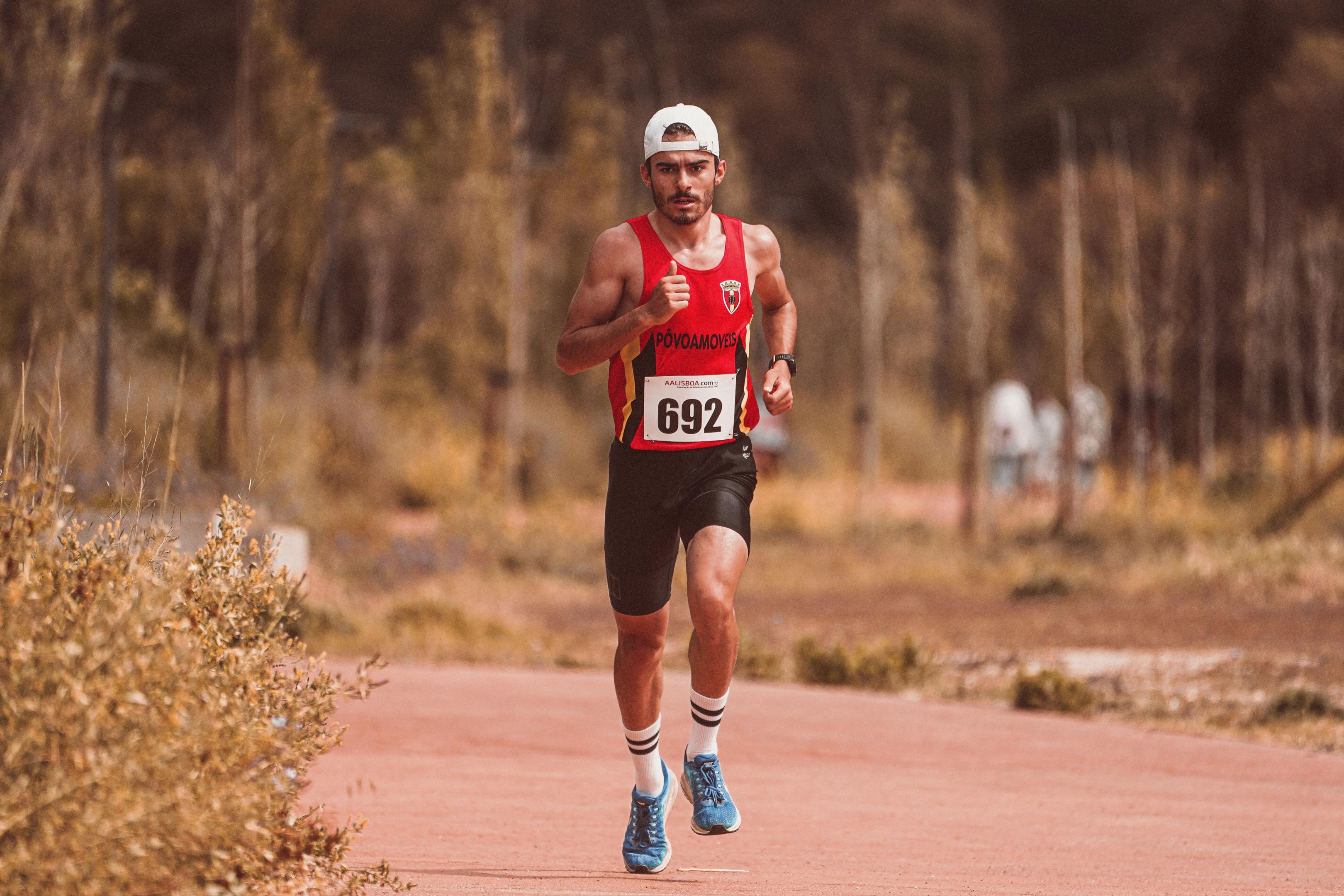 Leaning forward too much can affect your stride and running speed. This is why elite runners work hard to maintain proper running form and running technique especially during long distance runs.Photo by RUN 4 FFWPU: https://www.pexels.com/photo/man-wearing-tank-top-running-on-dirt-road-7523366/