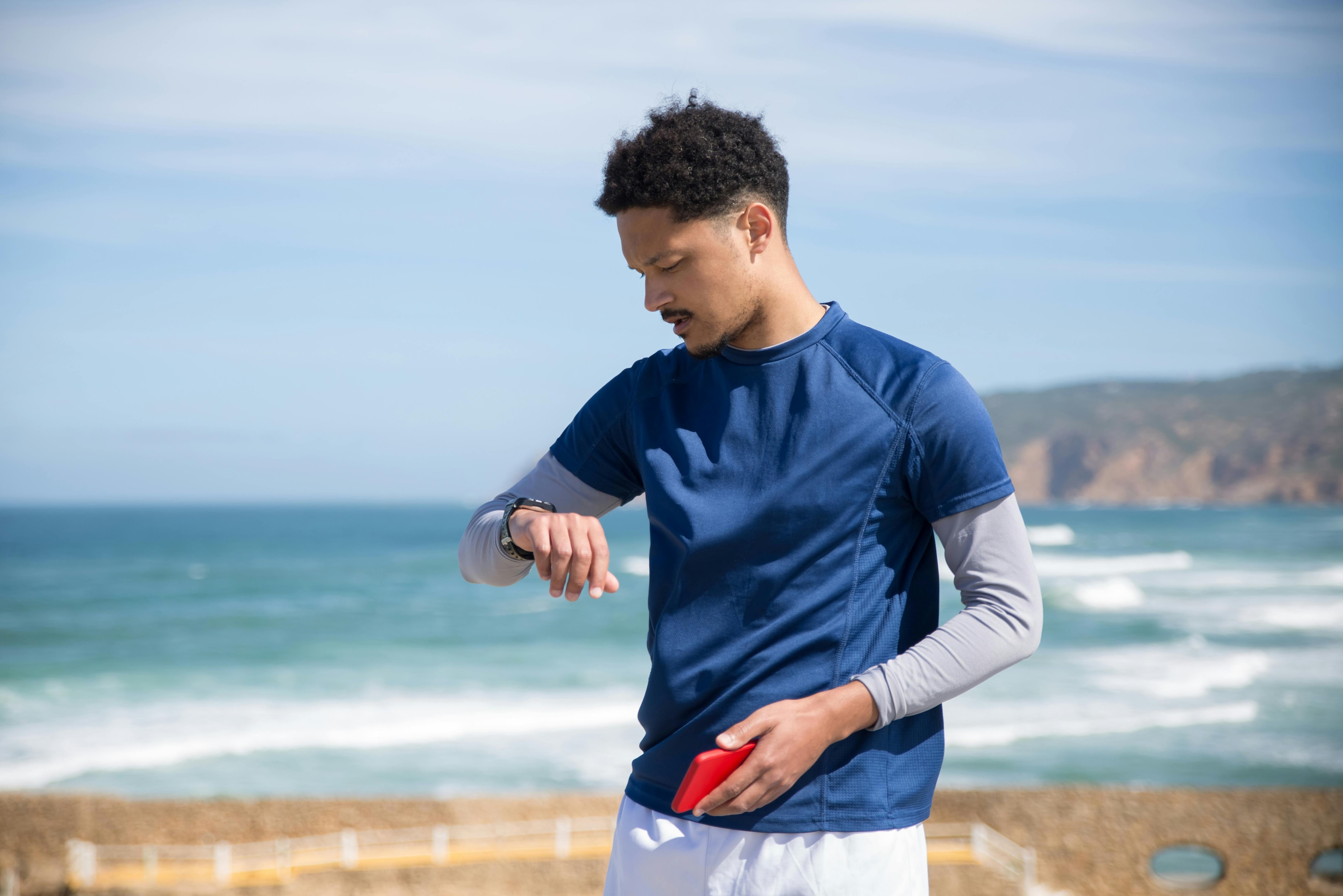 Even beginner runners can benefit from having running watches. Being aware of what your body goes through with every stride gives a runner the edge they need to stay healthy and safe as they hit the pavement.  Photo by Kampus Production: https://www.pexels.com/photo/a-man-standing-near-the-water-holding-a-phone-while-looking-at-the-watch-8381764/