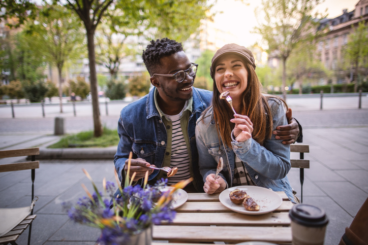 Happy couple at an outdoor restaurant.