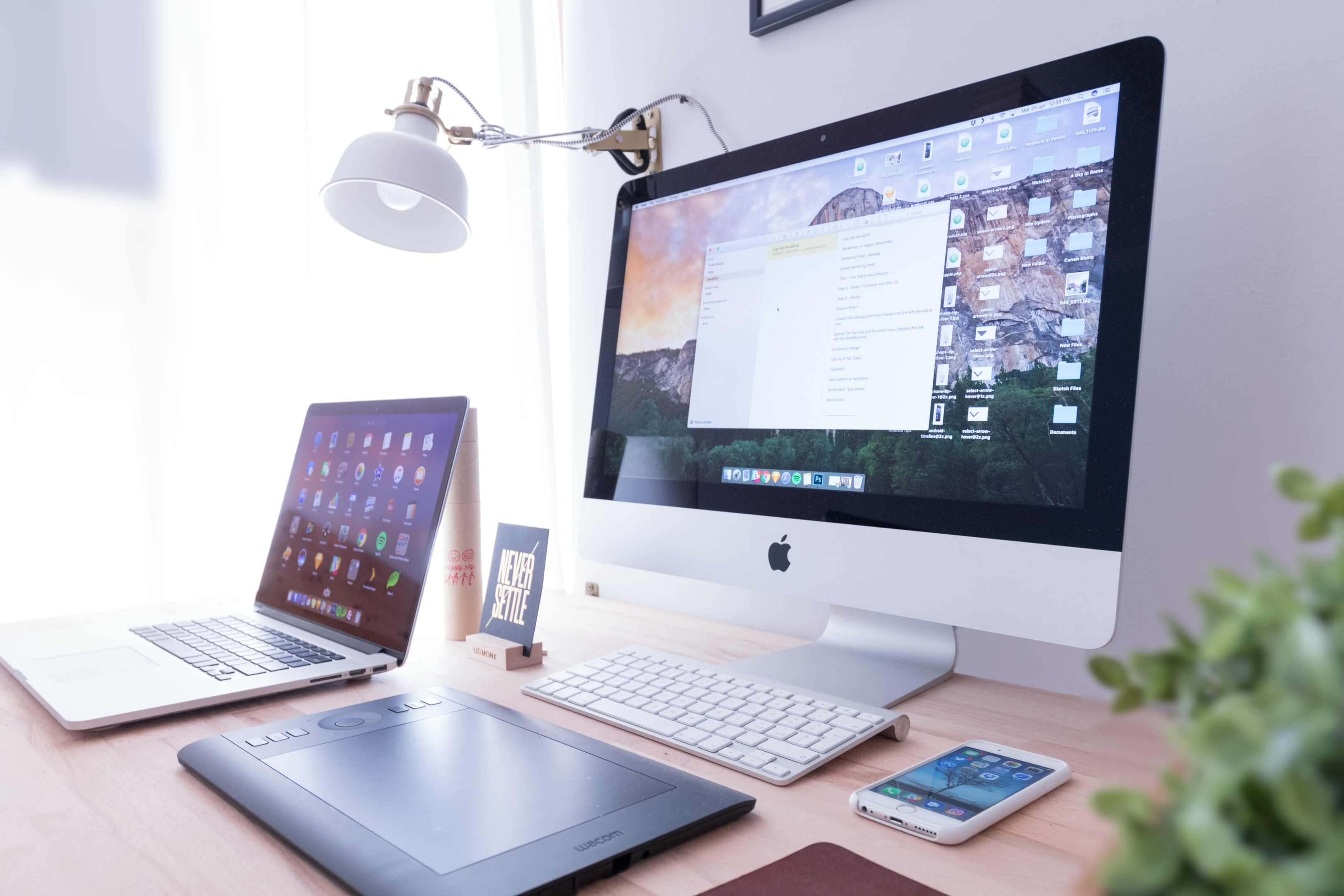 Real estate investor's desk setup with software handling portfolio management. 