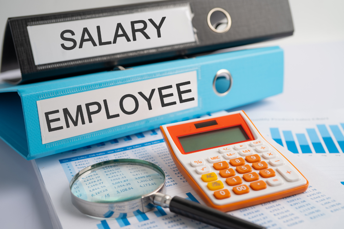 Employee and salary folders with calculator and HR data chart