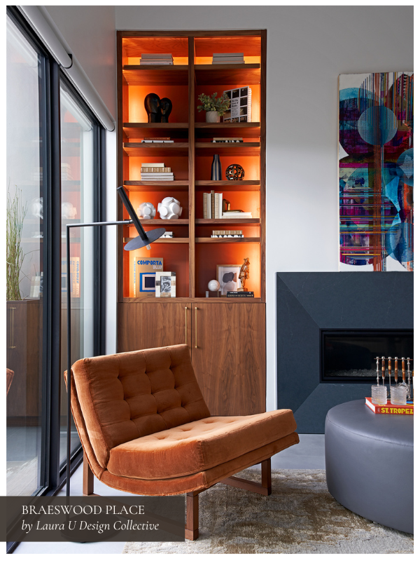 a living room vignette with walnut, blue, and velvet accents