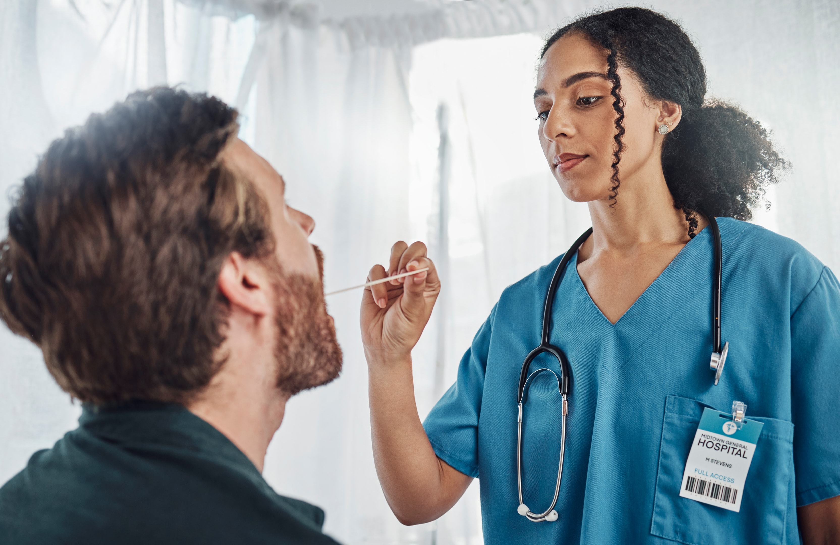 Surgeon consulting patient about tooth removal calgary 
