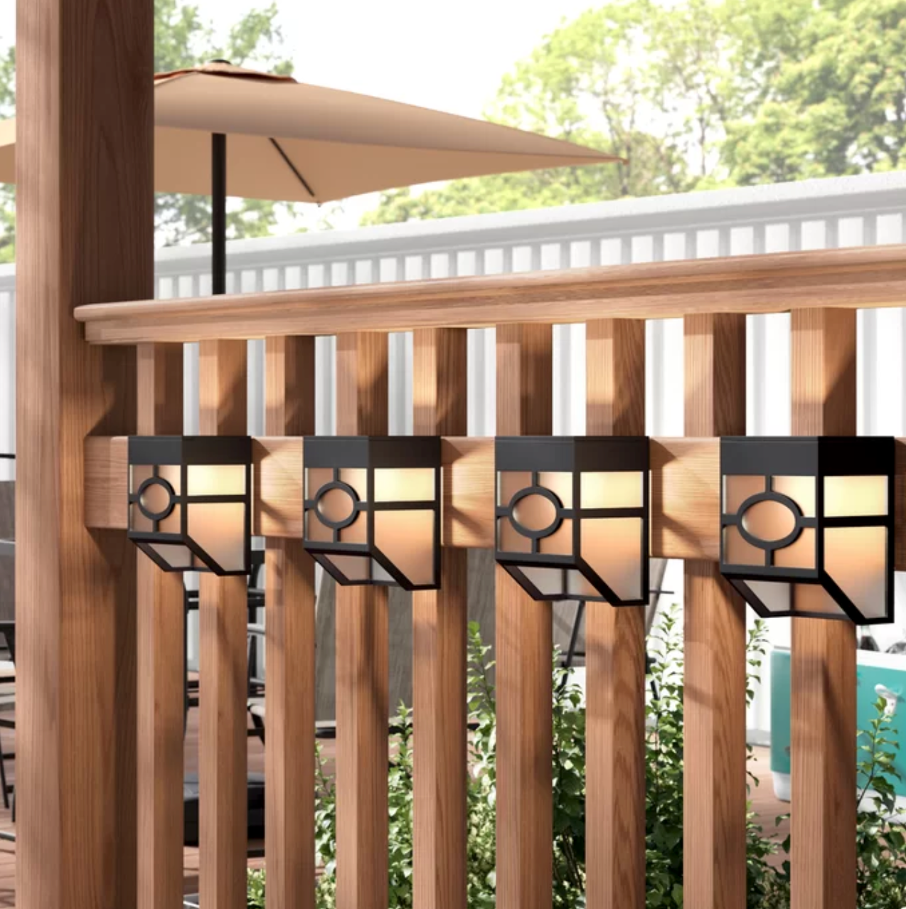 Wall lights used on a wooden fence in an outdoor space