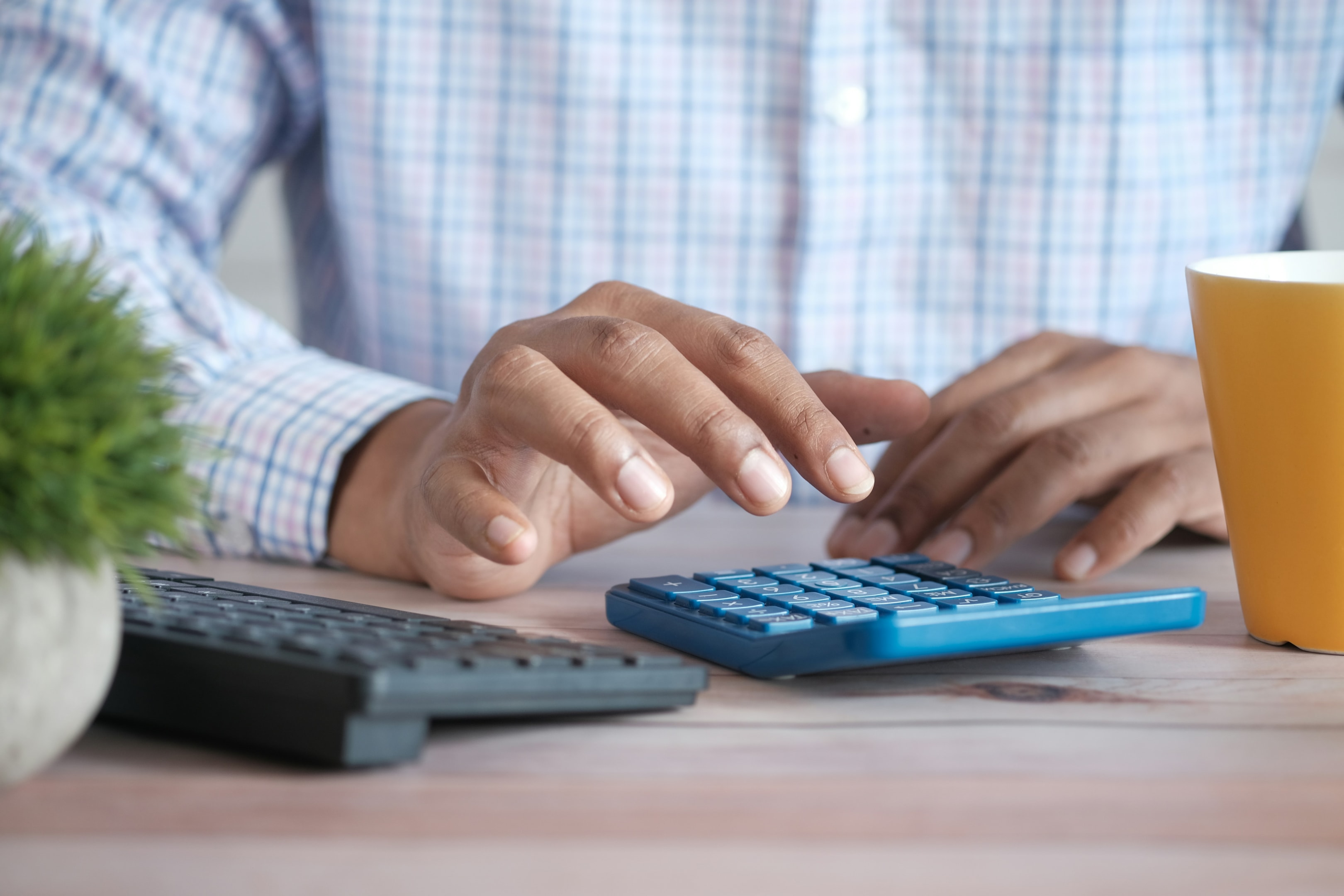 Real estate investor calculates cost of first property. 