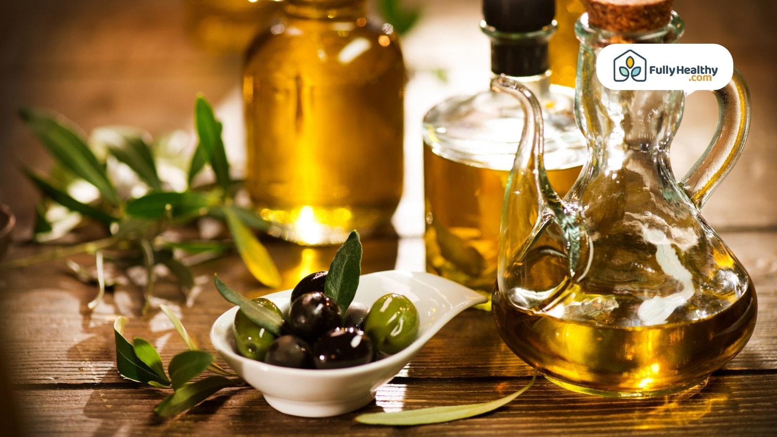 Olive oil bottles and fresh olives on rustic wooden table surface