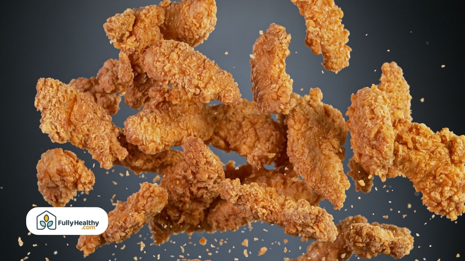 Crispy golden fried chicken tenders floating against dark background