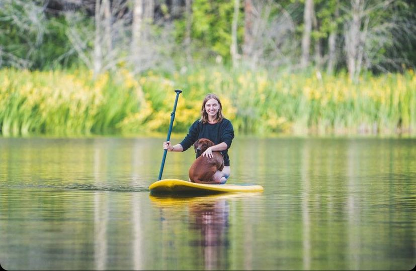 woman sitting on a paddle board