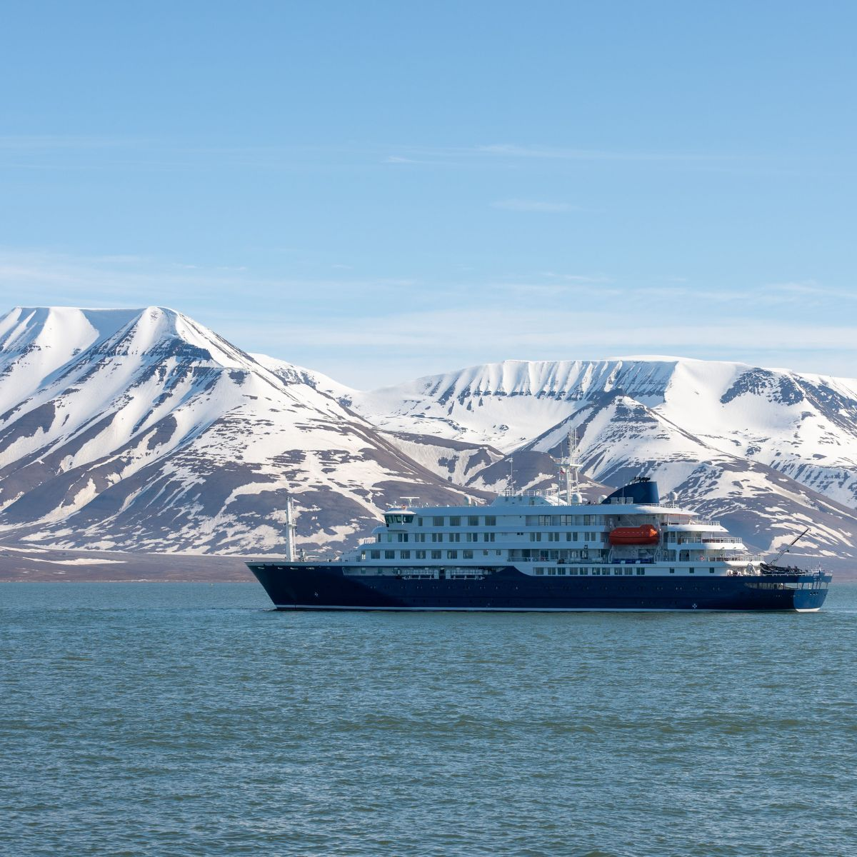 Cruise passing icebergs