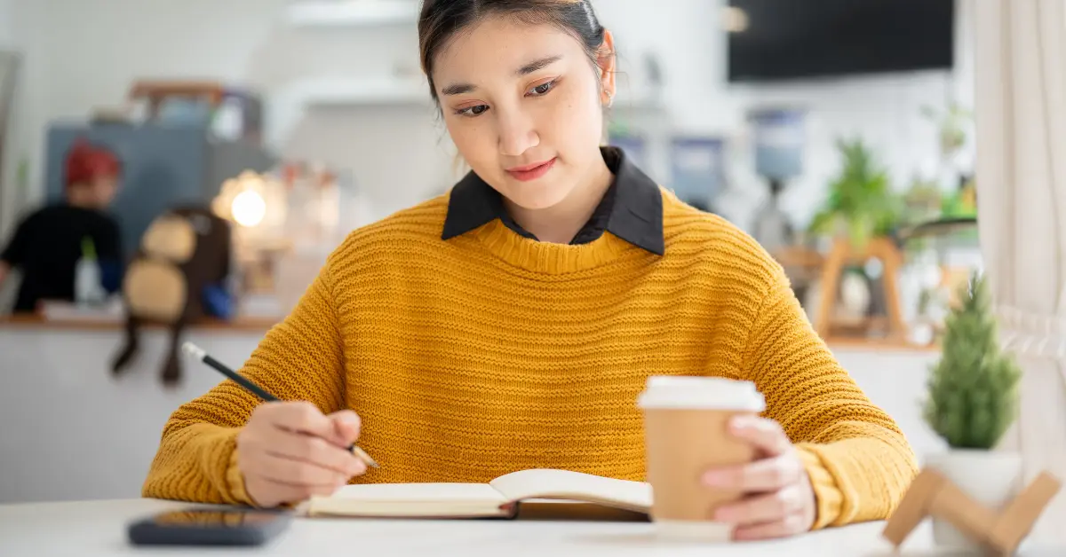 Woman tracking cash inflows and outflows for her OnlyFans business to create a reliable cash flow model.