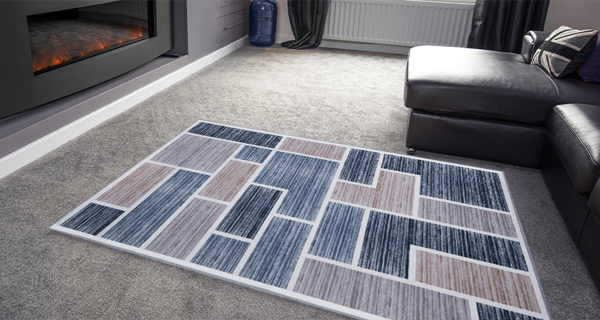 The Artiss Oblo rug has a simple and classic design that suits many interior styles. In this grey and black lounge setting, it is used to offset the monochromatic colour palette and absorb warmth from the built-in heater.