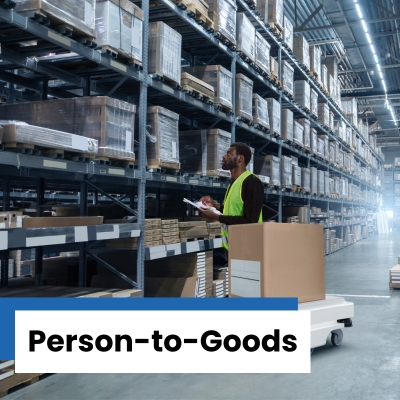 Man in yellow safety vest checking inventory with white mobile robot next to him