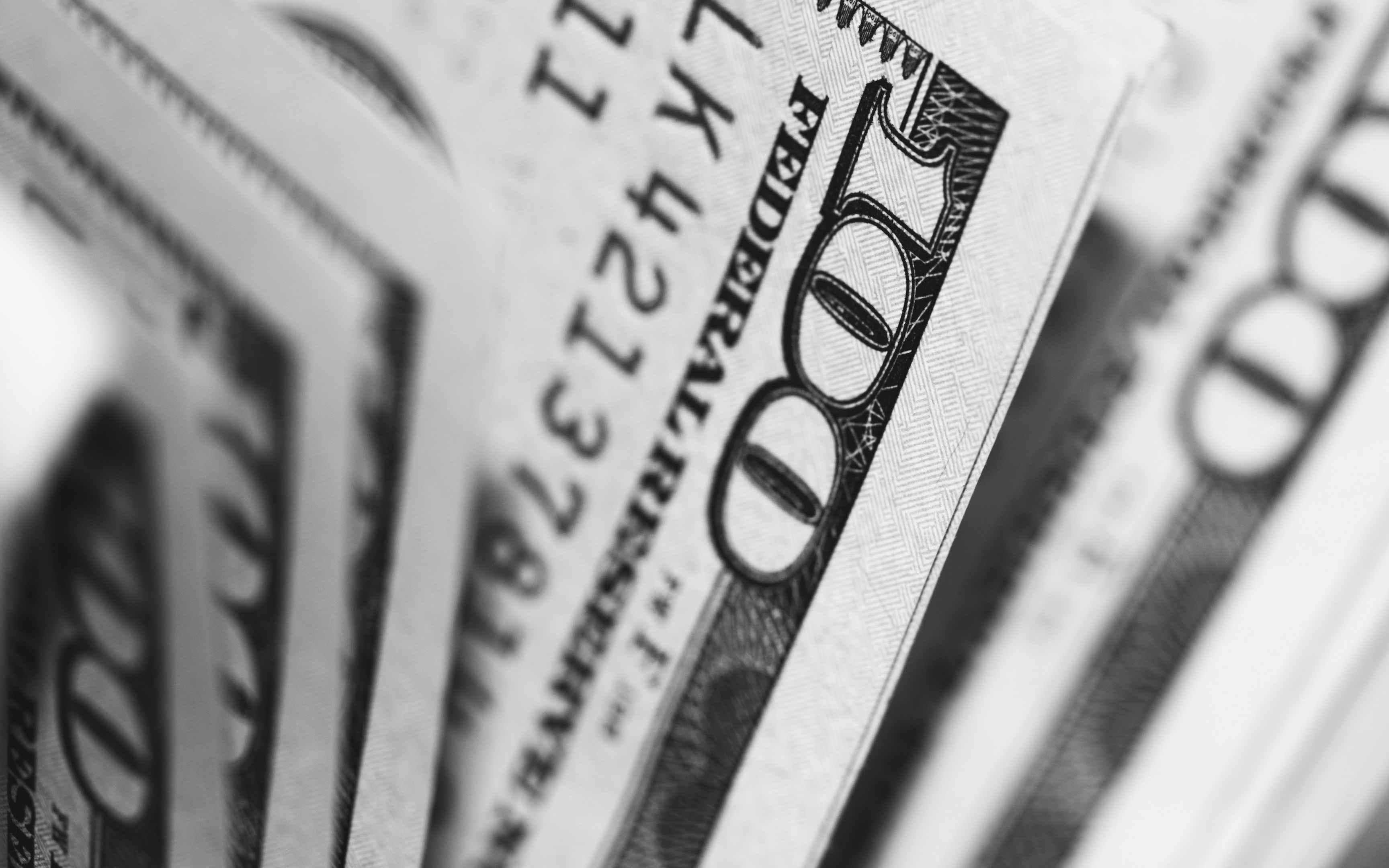 Hundred dollar bills lined up and used to fund a real estate transacation.
