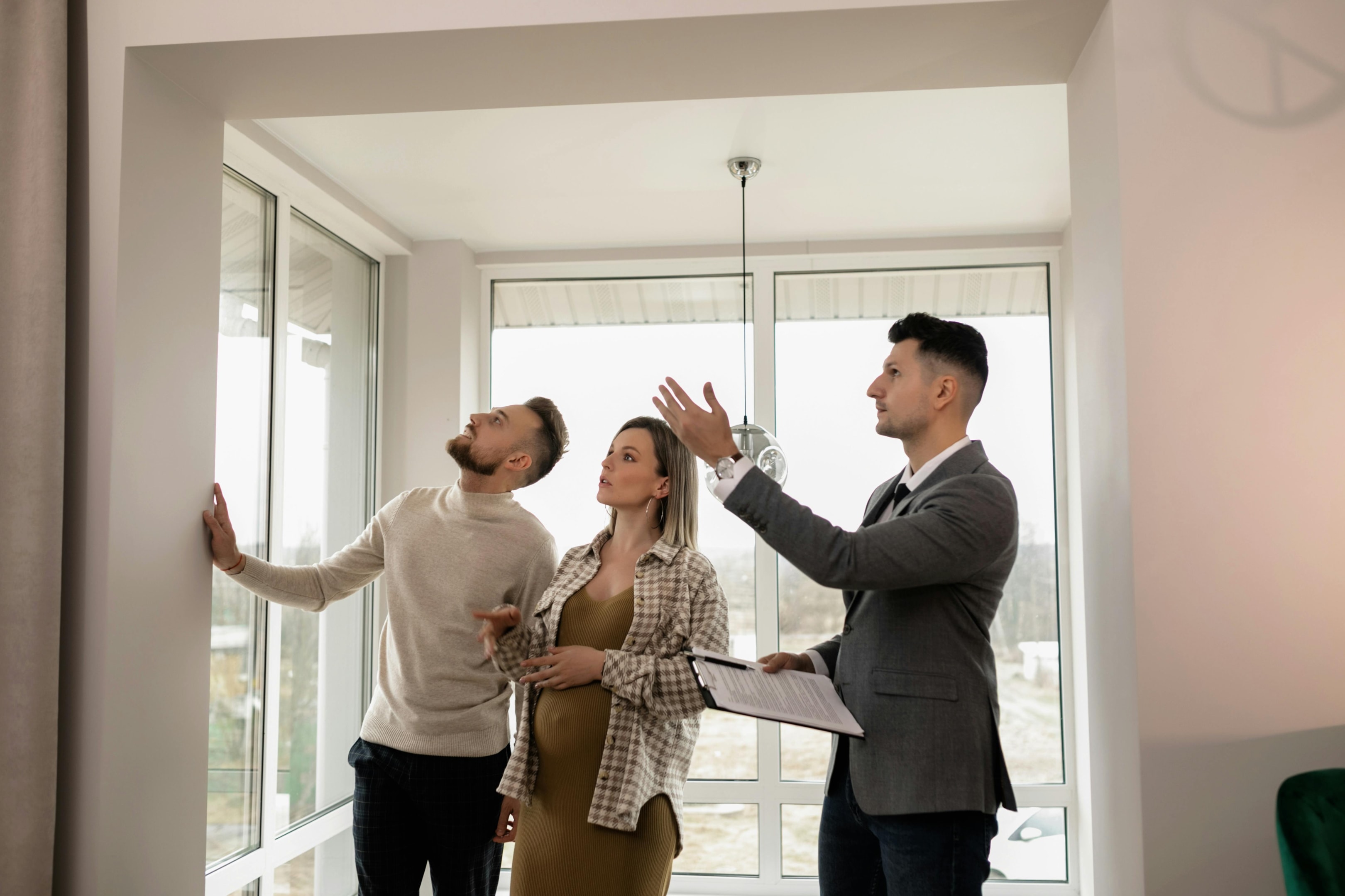 Real estate investment team does final walkthrough of property after having fire damages repaired.