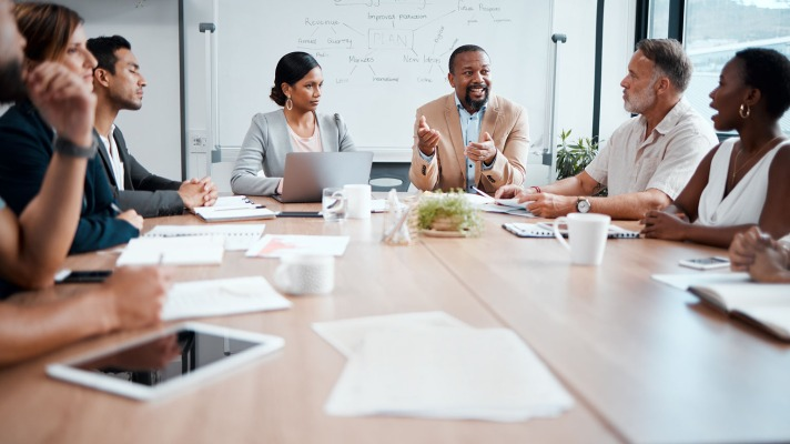 People from different backgrounds and professions discussing ideas in a mastermind group