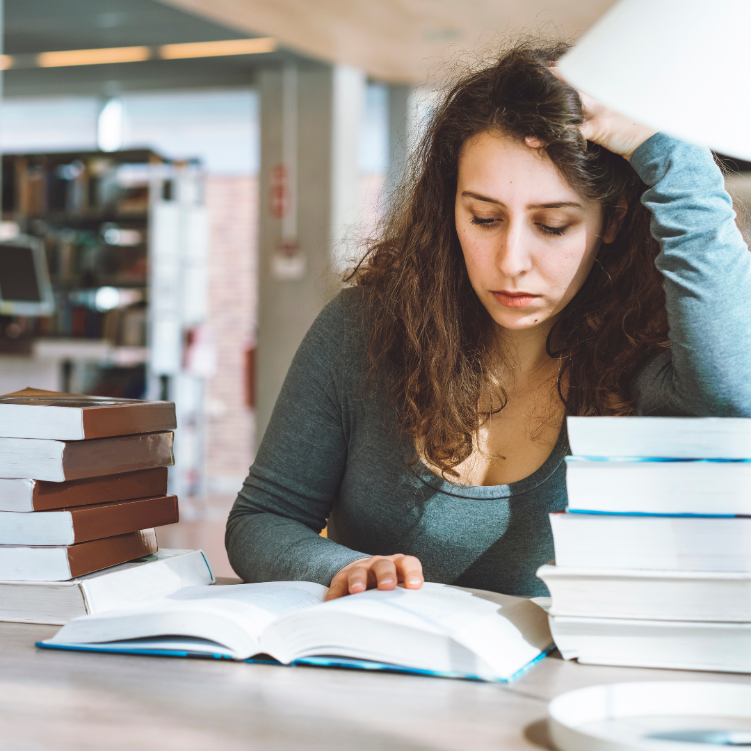 Woman looking stressed as she studies