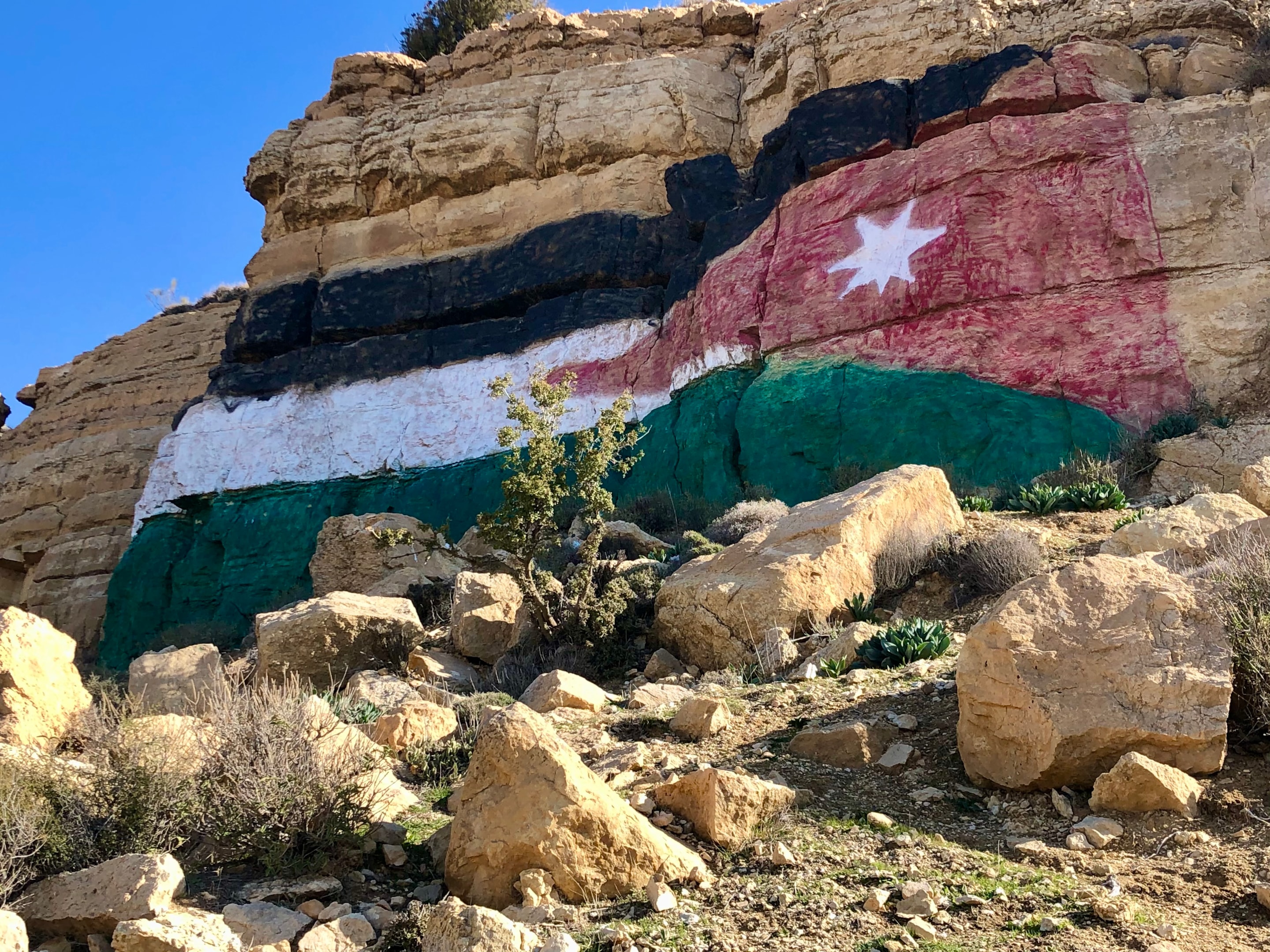 A Jordan flag on the side of the road 