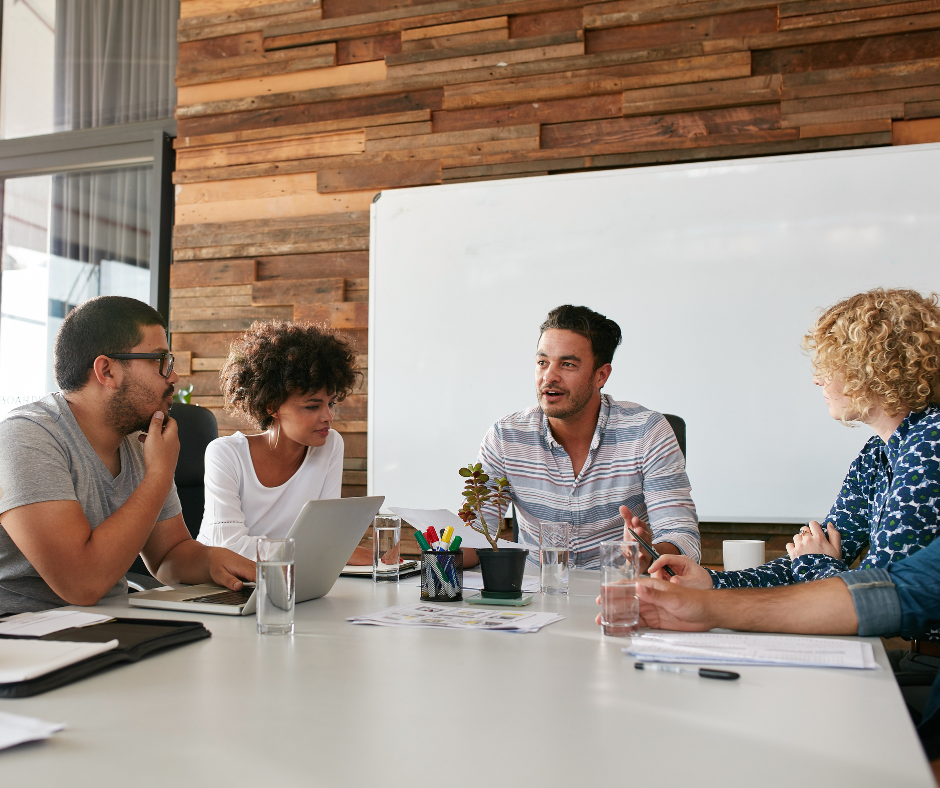 A group of professionals discussing the best alcohol rehab program for a patient