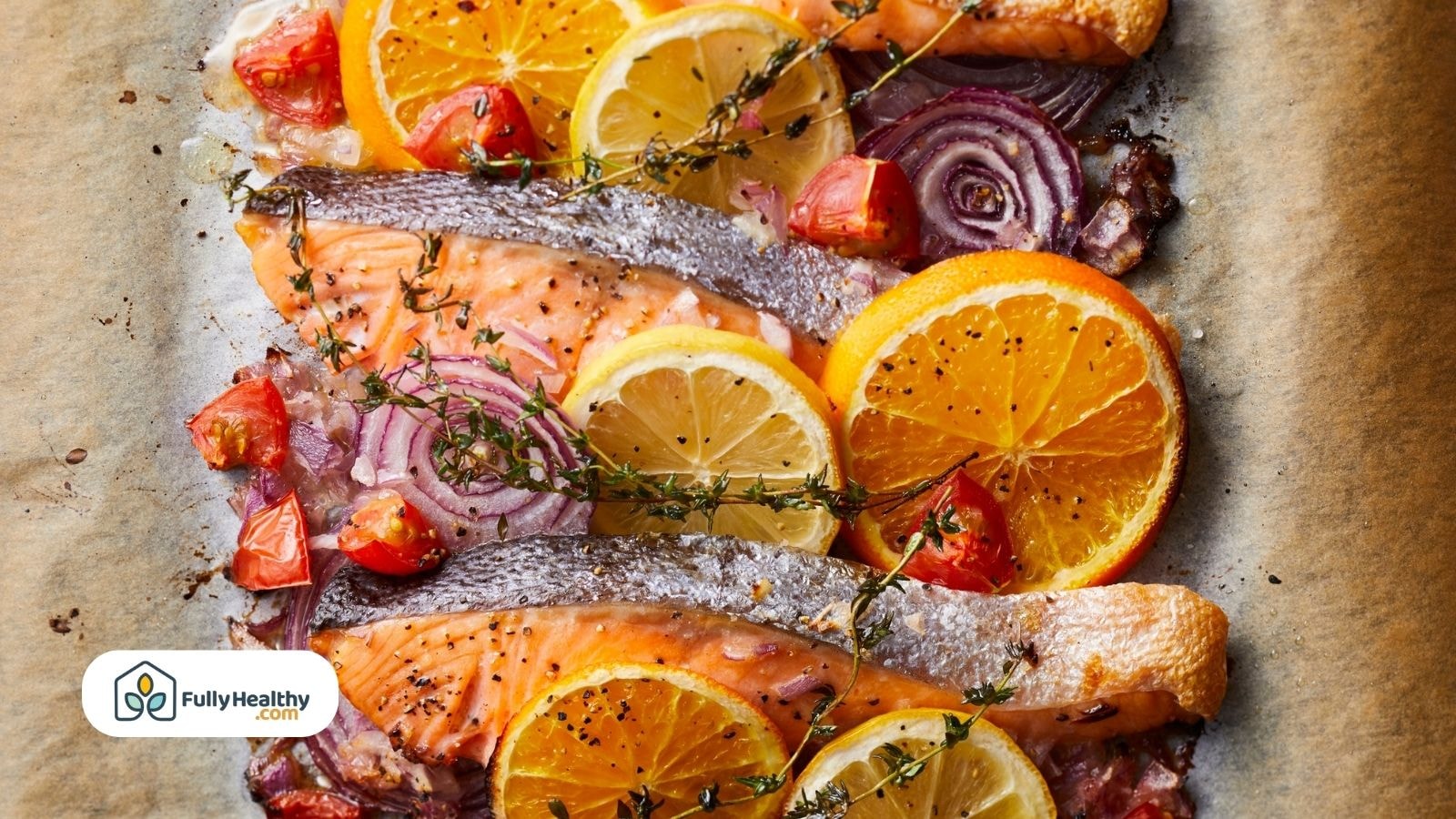 Baked salmon with citrus, red onion, and herbs on parchment
