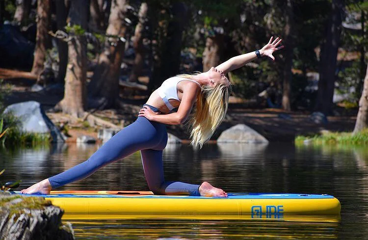 sup yoga on an inflatable paddle board