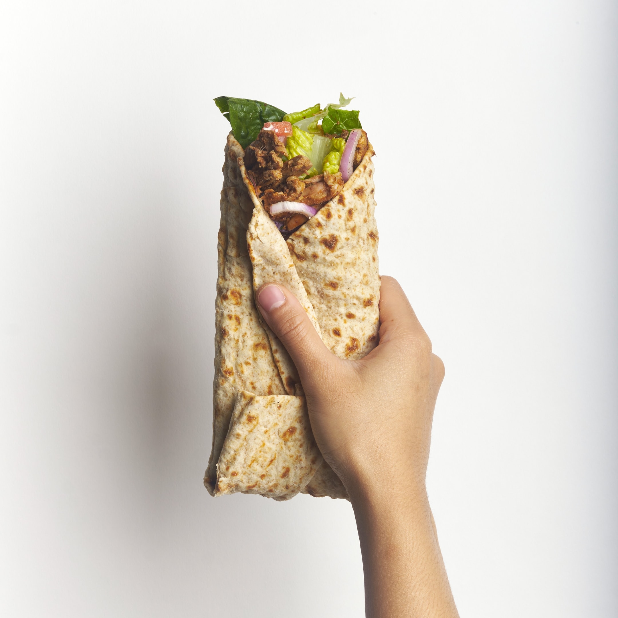 Naya chicken shawarma roll complete with fresh veggies. Get your chicken shawarma bowl! Find a Naya near you in NYC, NJ, CT, Philly