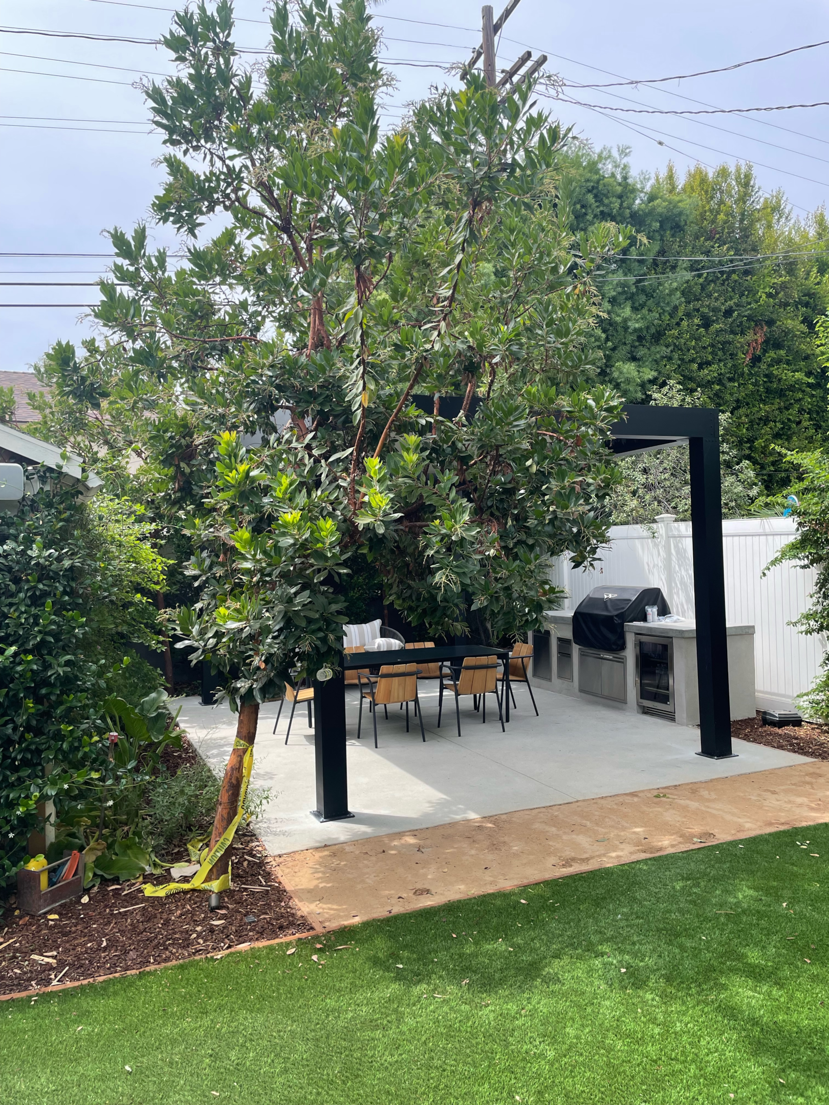 Seating area at outdoor dining space designed similar to indoor space.