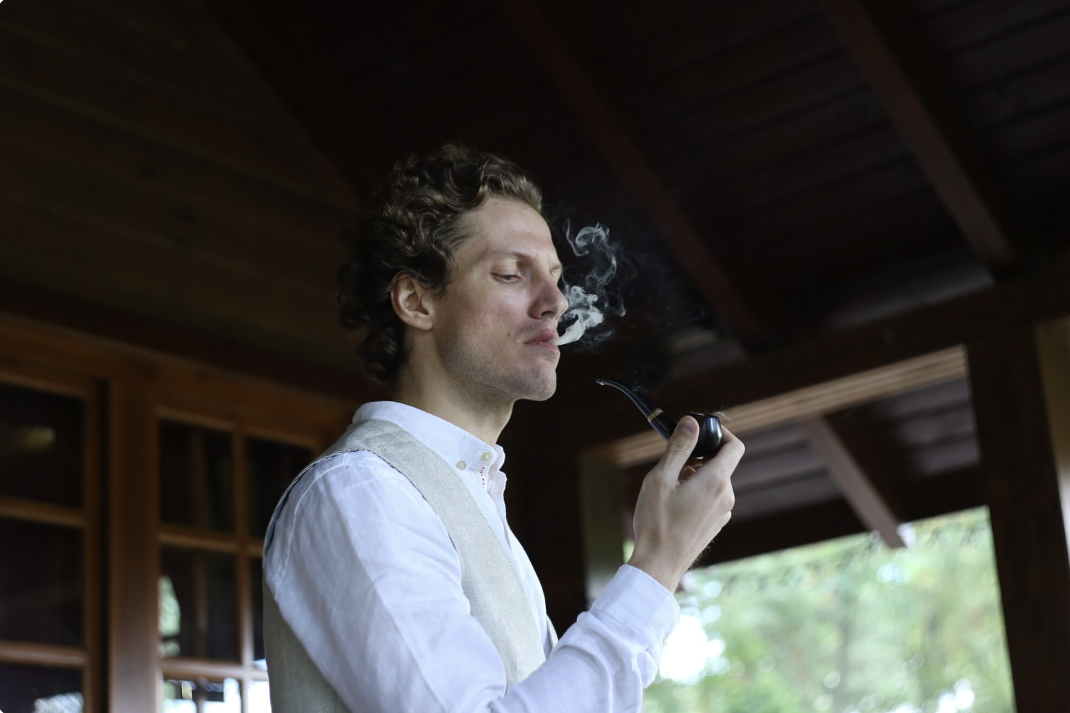 A man smoking indoors